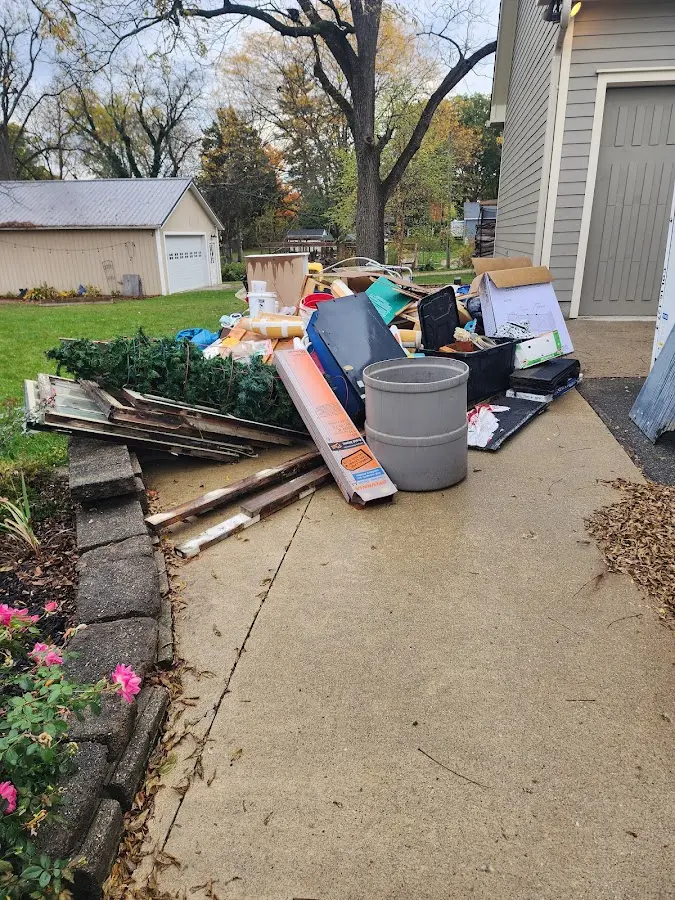 Dumpster being loaded with debris for 3 Yard Dumpster Rental in Upper Mount Bethel